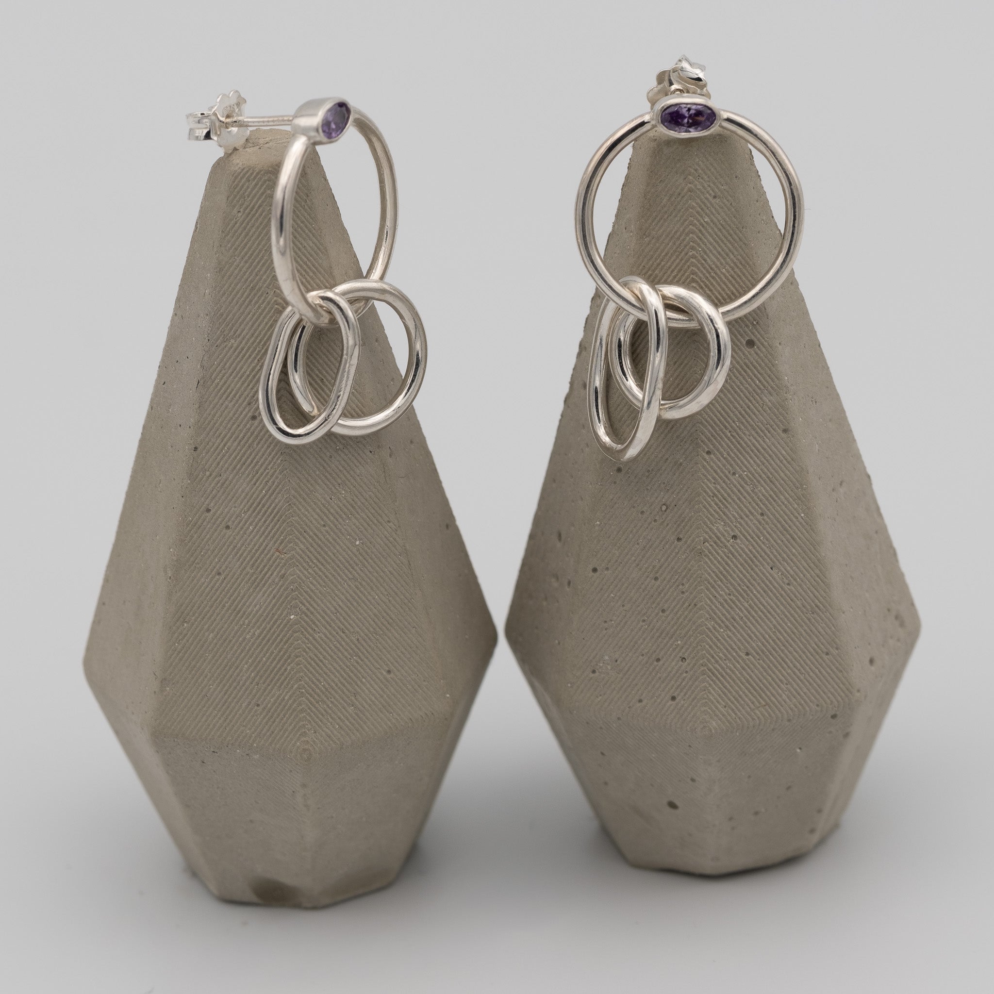 silver hoops with purple stone