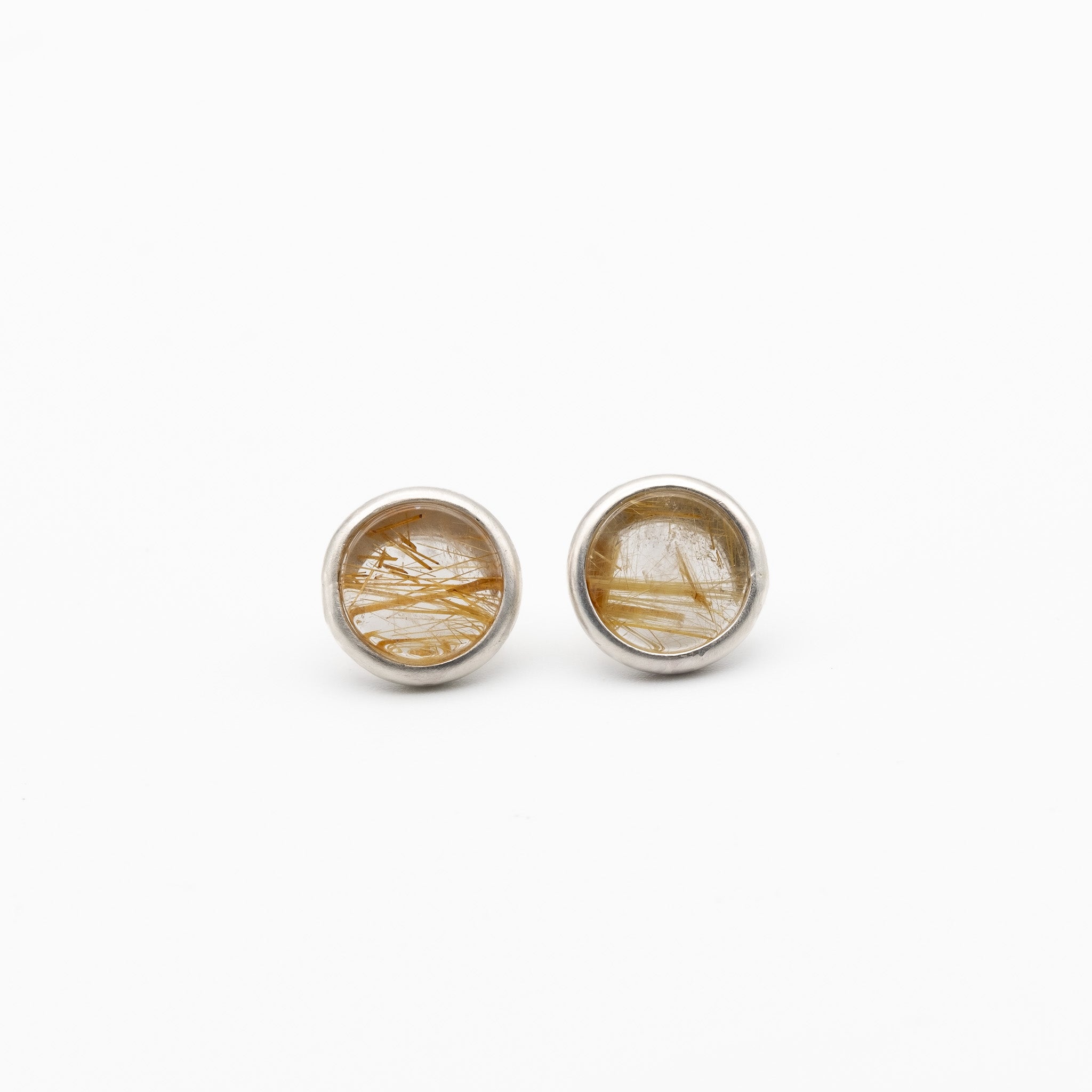 Round silver earrings with a natural stone design on a white background