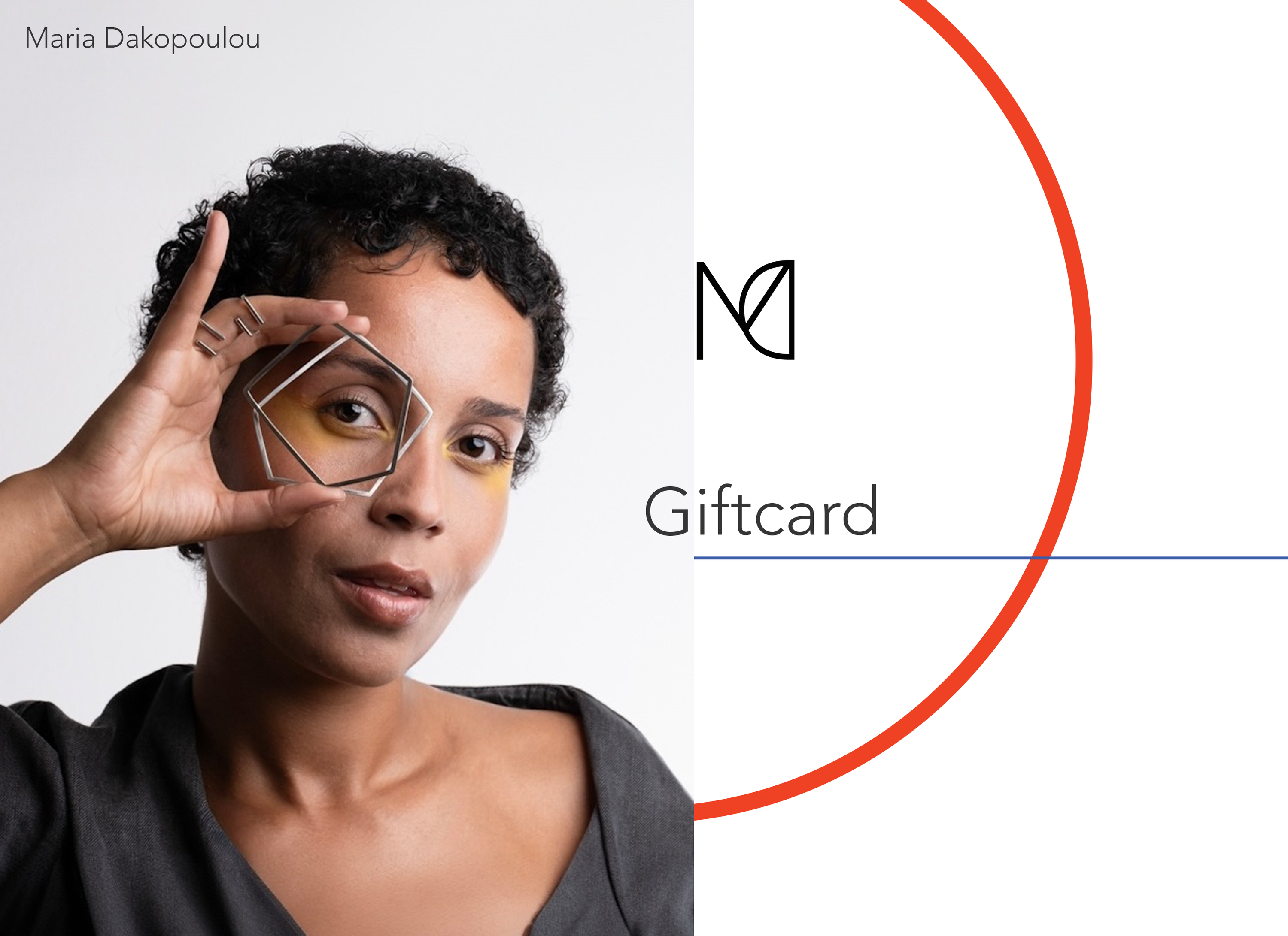 Person holding a geometric silver bangles  with a brand logo and &