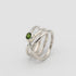 silver handmade ring in a shape of an orbit with a single gemstone set. now single silver wire wrapped and creating coils. 