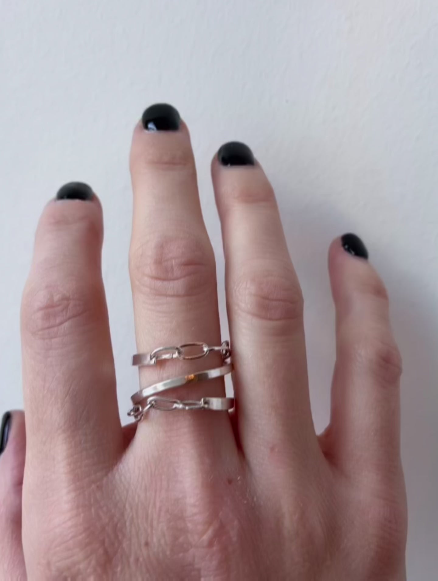 silver ring with chain three twists