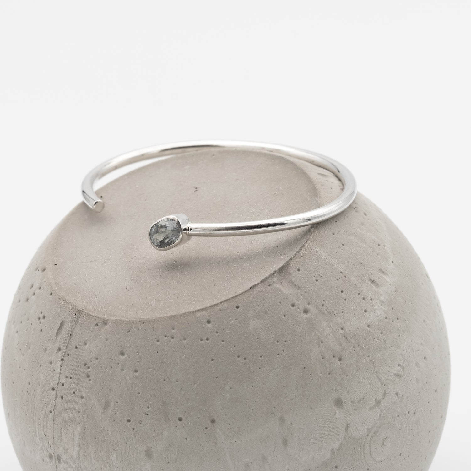 silver bangle with amystic topaz stone