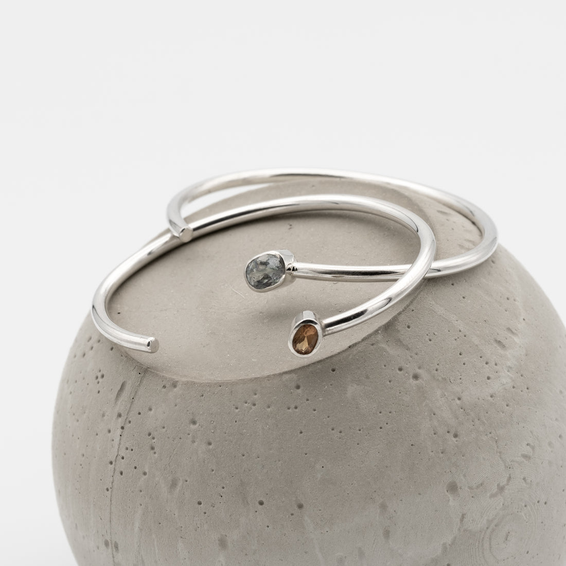 two silver bangles with citrine and mystic topaz