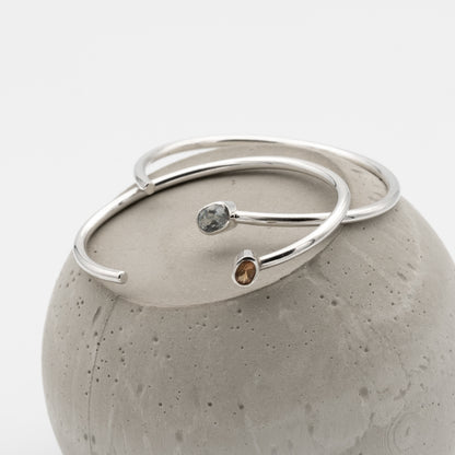 two silver bangles with citrine and mystic topaz