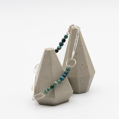 Jewelry with blue beads on a white background