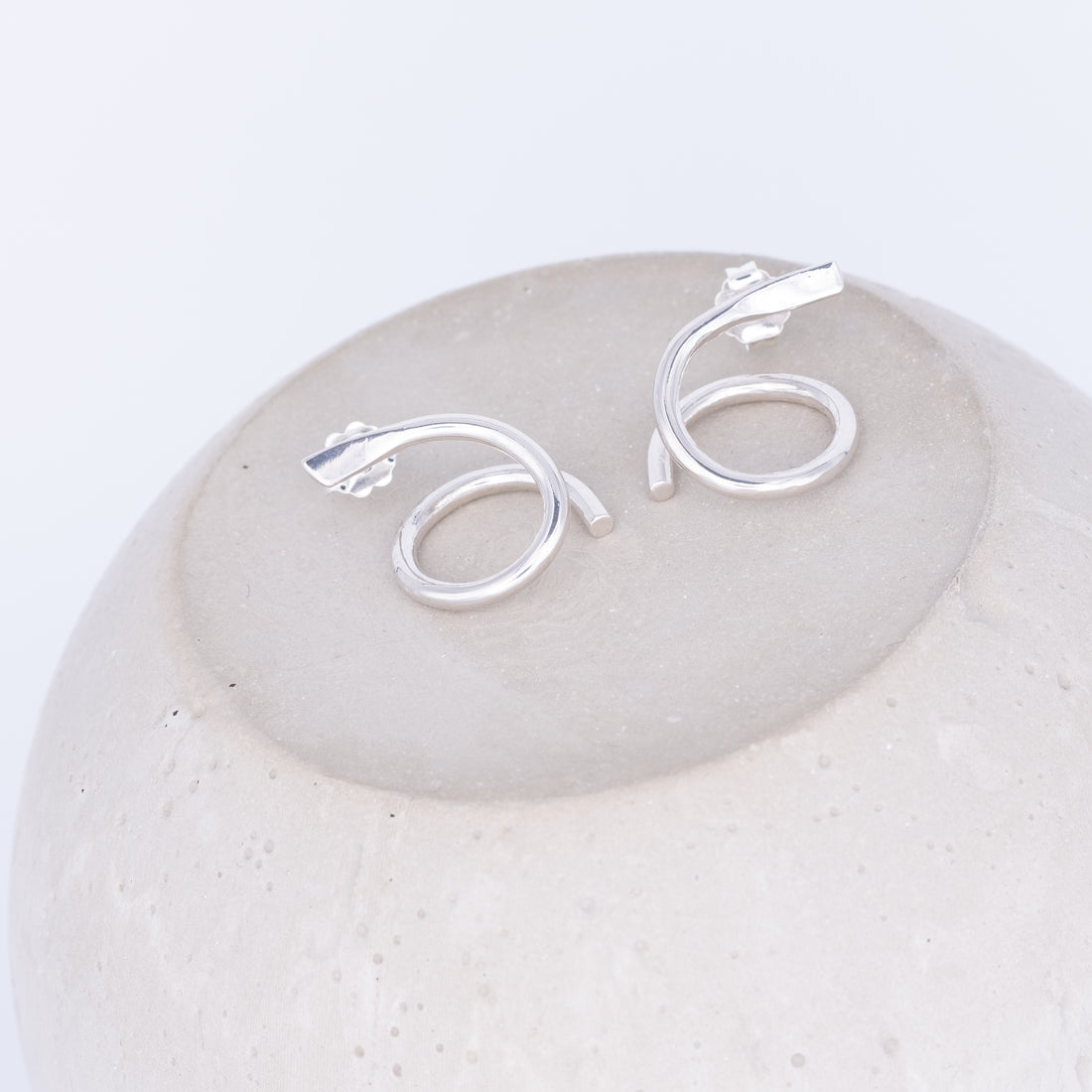 Silver earrings ^twisting