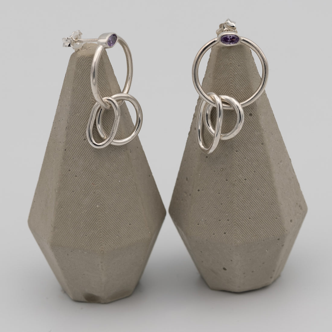 silver hoops with purple stone