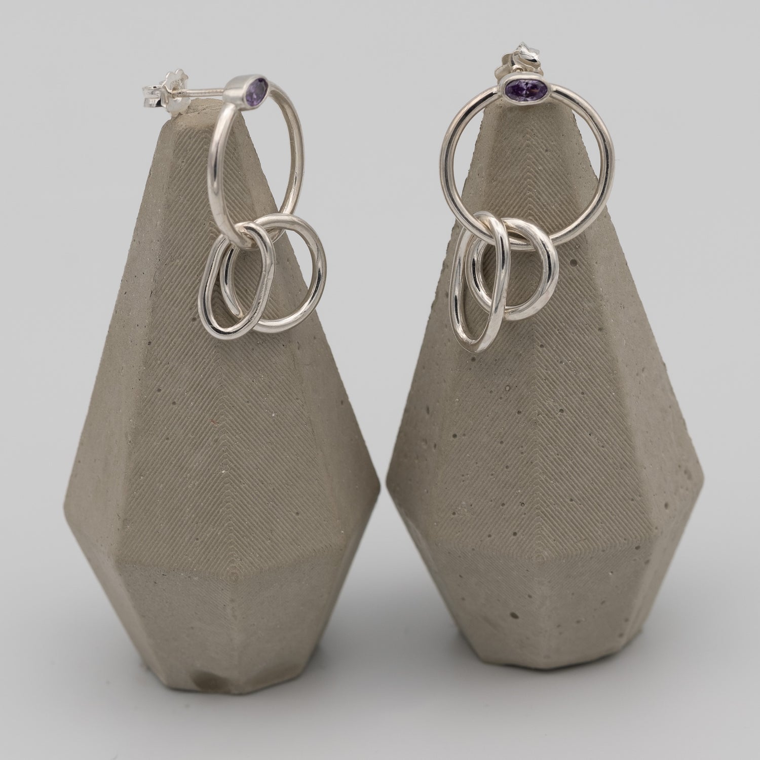 silver hoops with purple stone