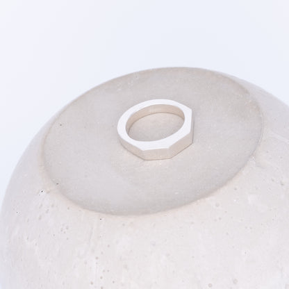 White ceramic bowl with a geometric ring on a white background
