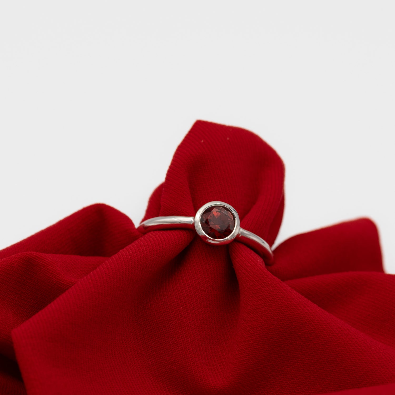 silver ring with red garden 